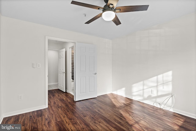 unfurnished room featuring ceiling fan and dark hardwood / wood-style flooring