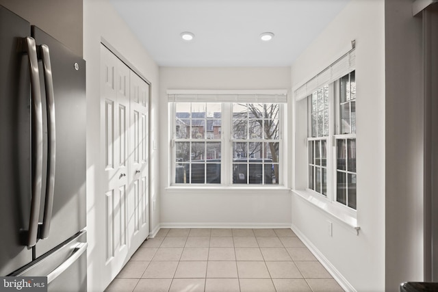 unfurnished sunroom featuring plenty of natural light