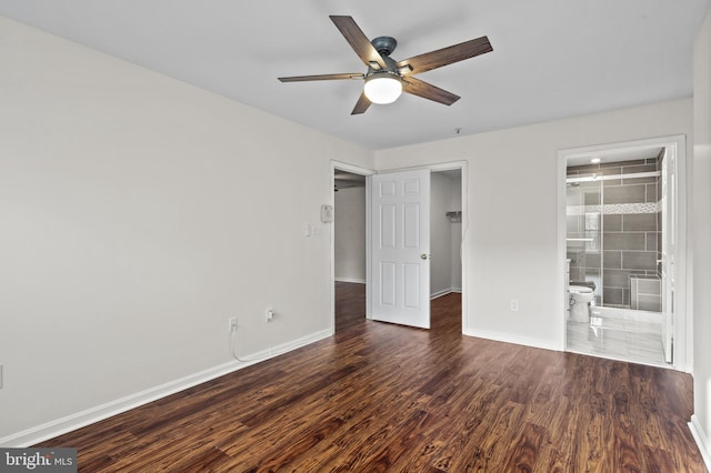 spare room featuring dark hardwood / wood-style floors and ceiling fan