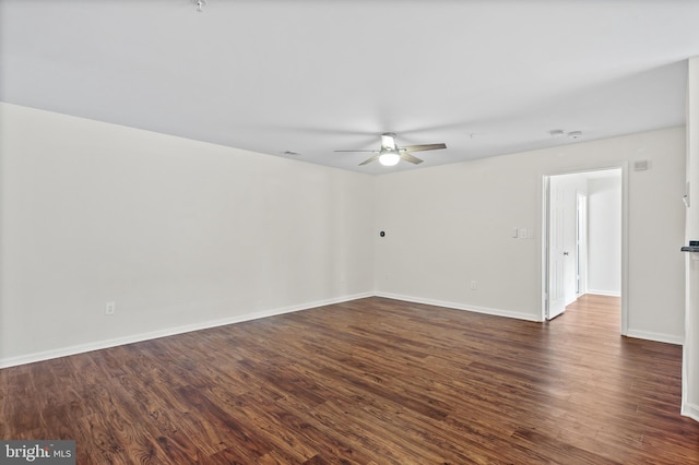 unfurnished room with ceiling fan and dark hardwood / wood-style flooring