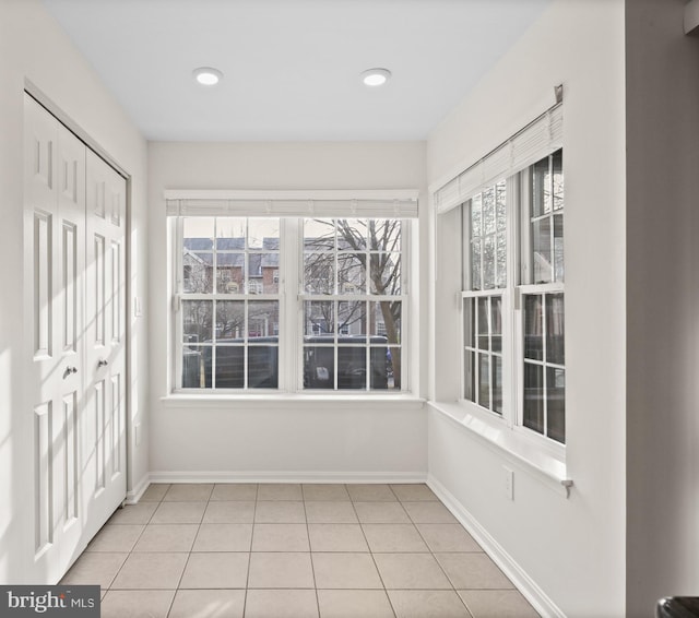 unfurnished sunroom featuring a healthy amount of sunlight