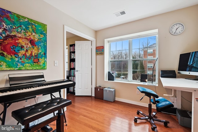 office space with light hardwood / wood-style flooring