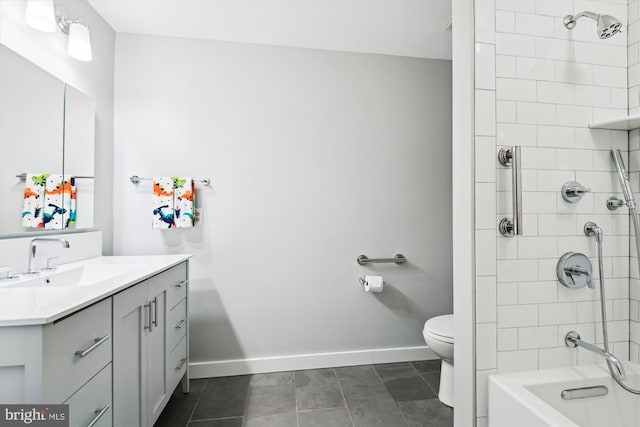 full bathroom featuring vanity, tiled shower / bath, tile patterned flooring, and toilet