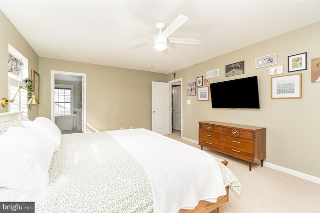 bedroom featuring light colored carpet and ceiling fan