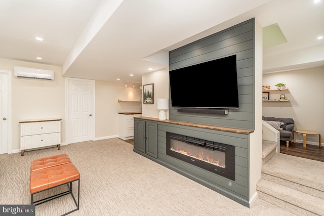 living room featuring light colored carpet and a wall unit AC