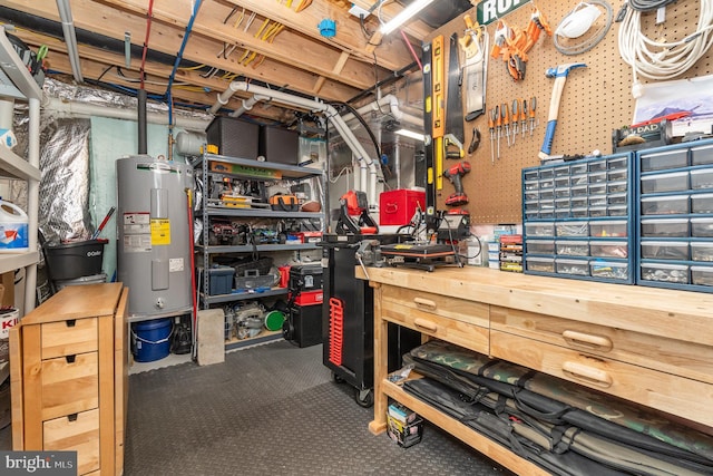 basement with water heater and a workshop area