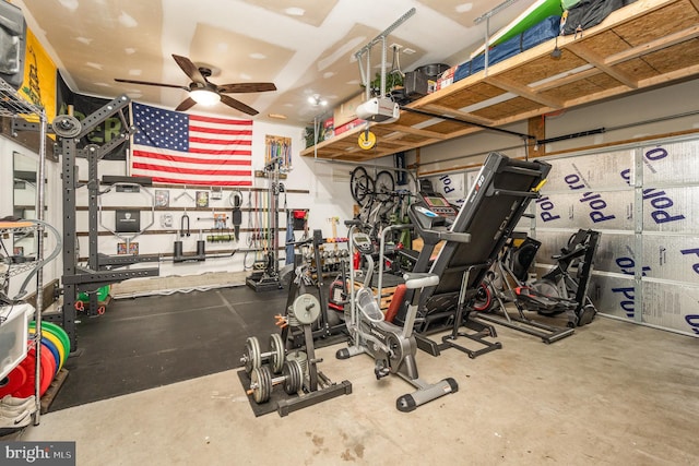 garage with a garage door opener and ceiling fan