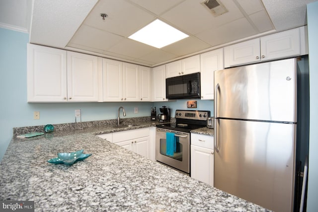 kitchen featuring white cabinetry and stainless steel appliances