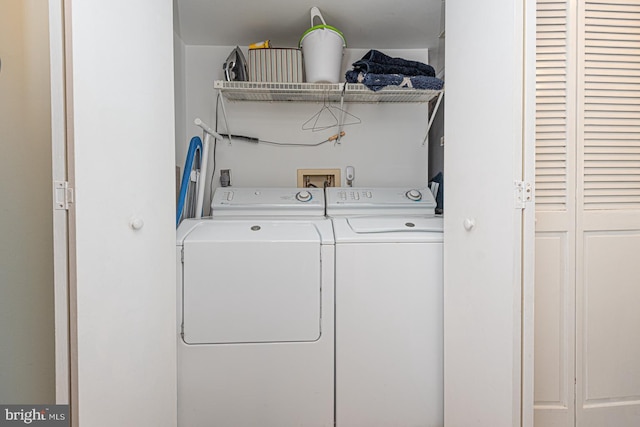 laundry room with washer and clothes dryer