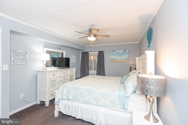 carpeted bedroom featuring crown molding and ceiling fan