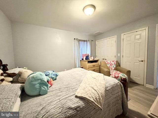 bedroom with light wood-type flooring