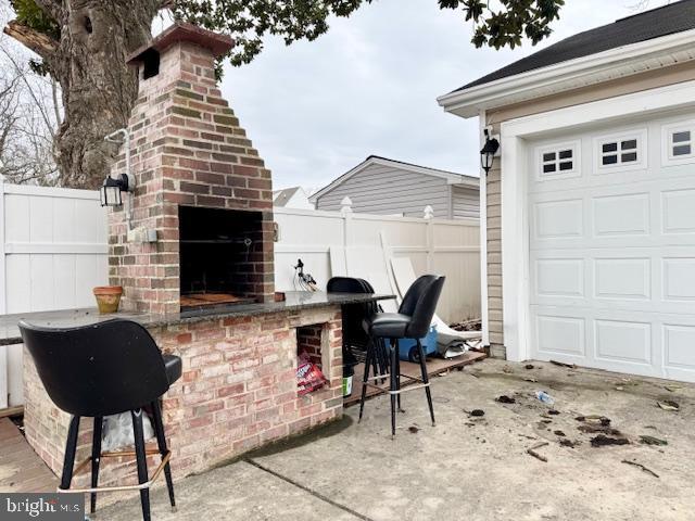 view of patio / terrace featuring exterior bar