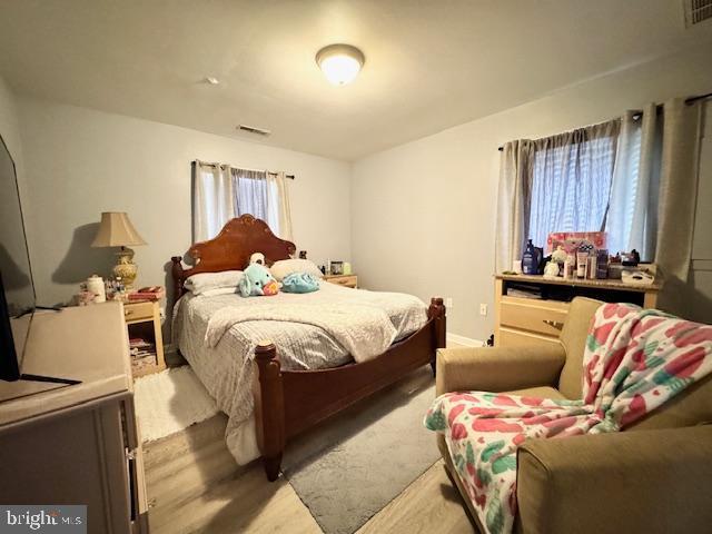 bedroom with light hardwood / wood-style flooring