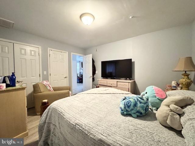 bedroom with light hardwood / wood-style floors