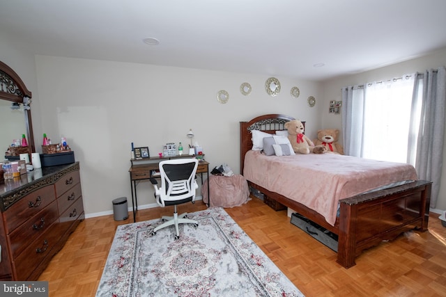 bedroom with light parquet floors