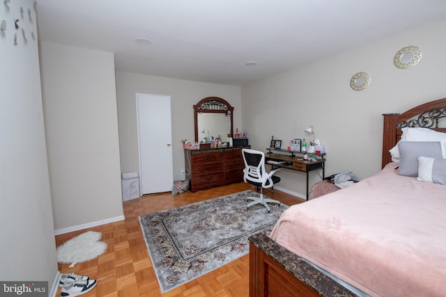 bedroom featuring light parquet floors