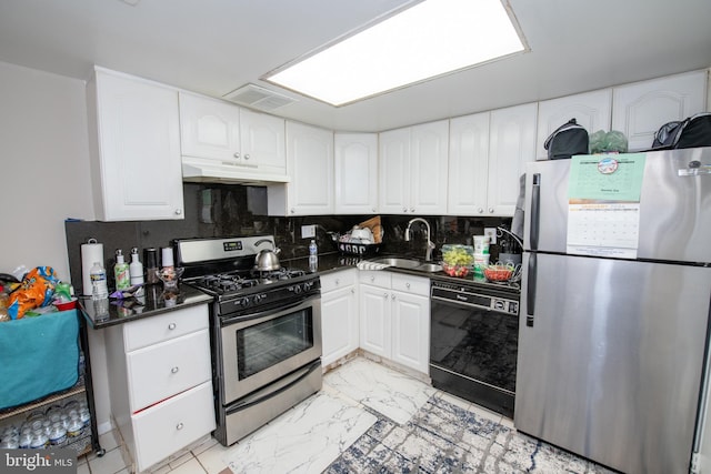 kitchen featuring appliances with stainless steel finishes, sink, white cabinets, and decorative backsplash