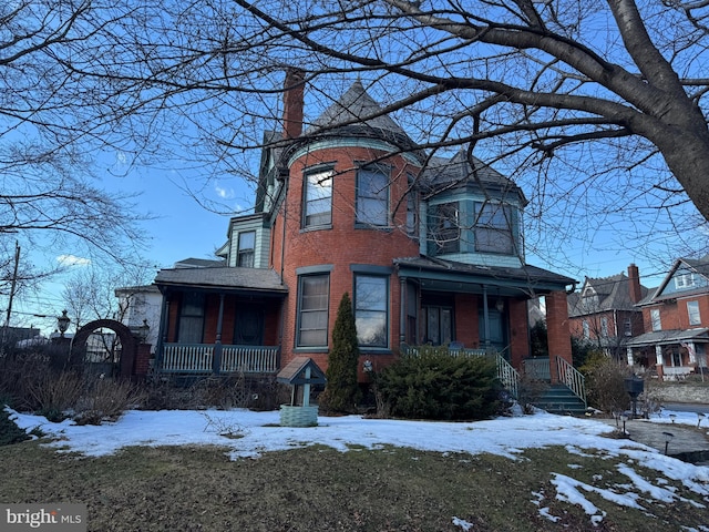 victorian house featuring covered porch