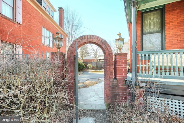 view of gate featuring a patio