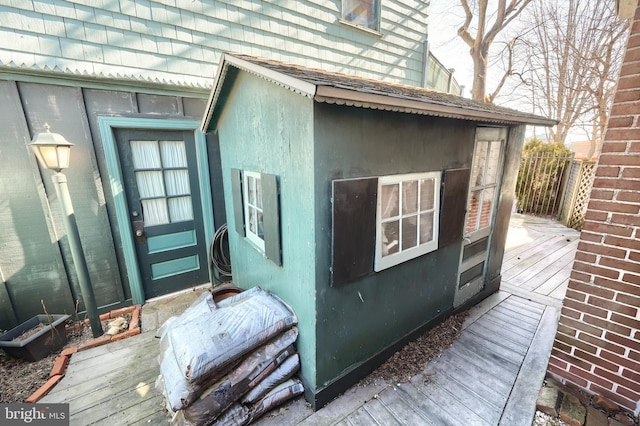 view of side of property featuring a deck