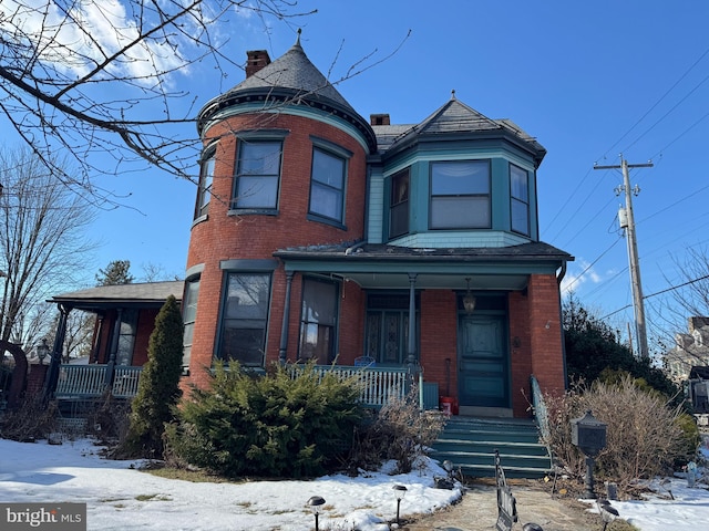 victorian home featuring a porch