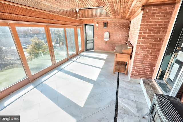 unfurnished sunroom featuring wooden ceiling