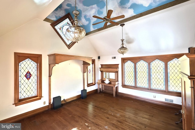 interior space featuring ceiling fan, dark hardwood / wood-style floors, and lofted ceiling with beams