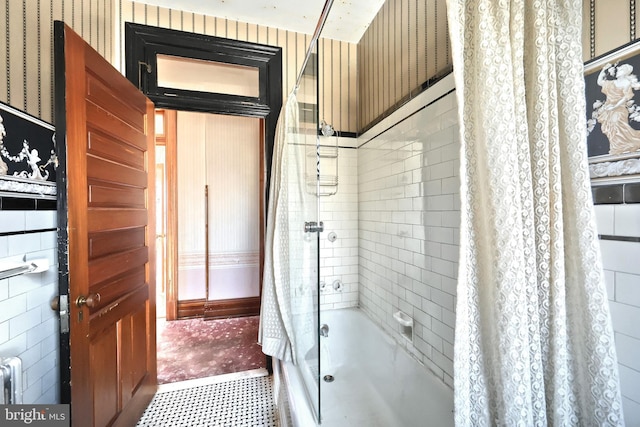 bathroom with shower / bathtub combination with curtain and radiator