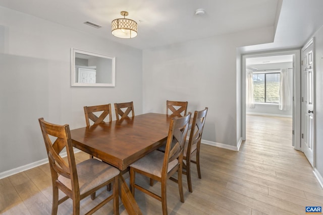 dining area featuring light wood-type flooring