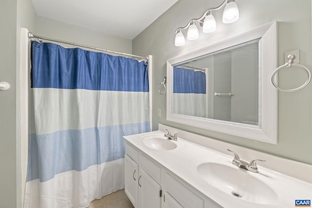 bathroom featuring vanity, curtained shower, and tile patterned floors