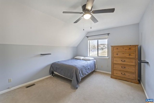 carpeted bedroom with ceiling fan and lofted ceiling