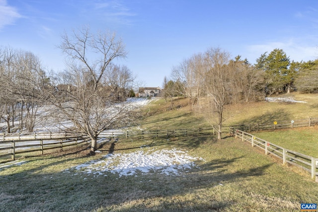 view of yard with a rural view