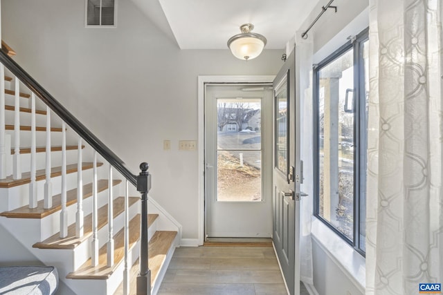 doorway with light hardwood / wood-style flooring