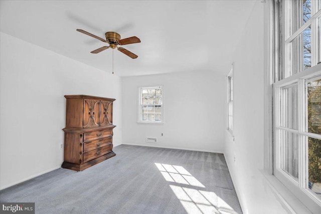 carpeted empty room featuring ceiling fan