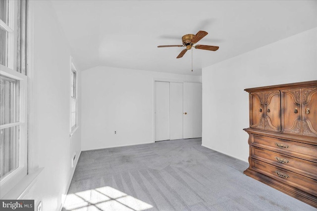 interior space with vaulted ceiling and ceiling fan