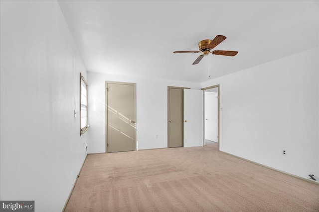 unfurnished bedroom featuring light colored carpet