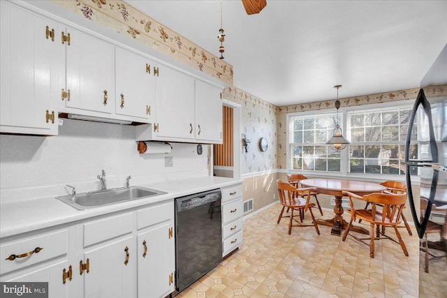 kitchen with white cabinetry, dishwasher, sink, and decorative light fixtures