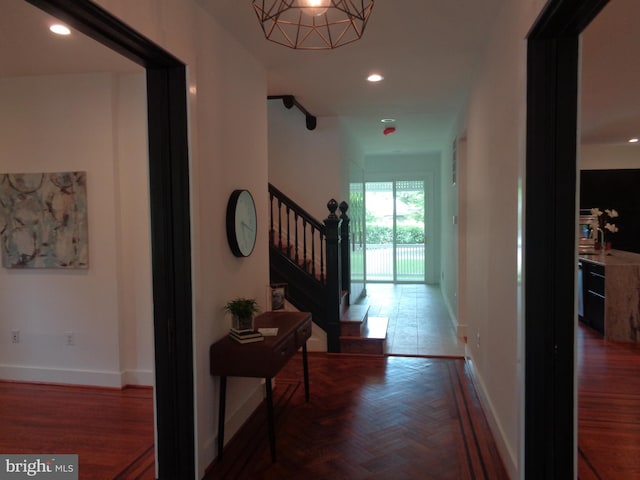 corridor featuring dark parquet floors