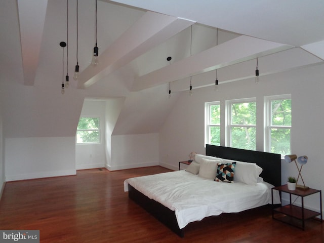 bedroom with lofted ceiling and dark hardwood / wood-style floors