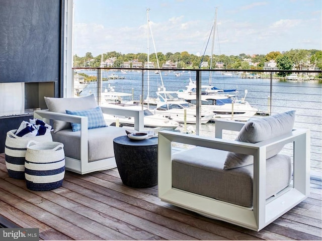 wooden deck with a water view