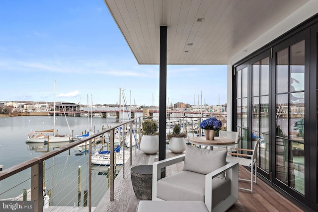 balcony featuring a water view