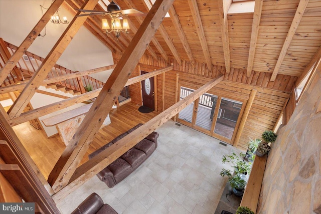 interior space with wood ceiling, beam ceiling, and high vaulted ceiling