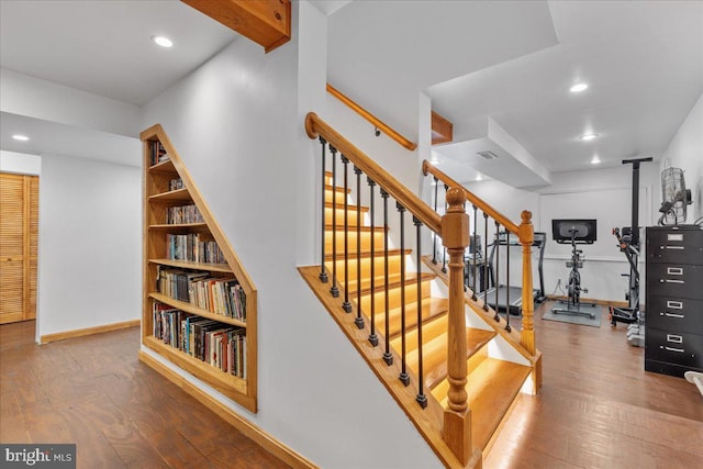 stairs with hardwood / wood-style floors