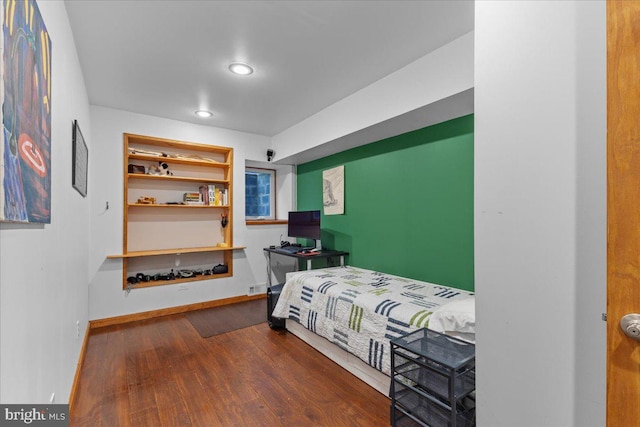 bedroom with wood-type flooring