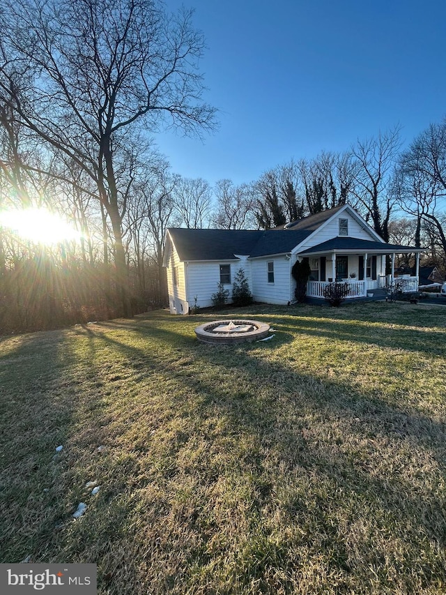 exterior space featuring a porch and a front yard