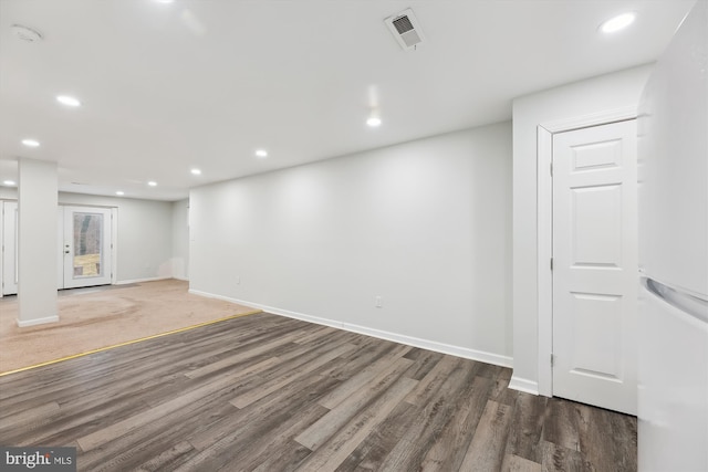 basement with dark wood-type flooring