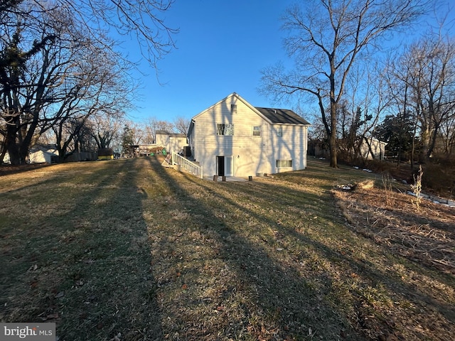 view of home's exterior with a yard