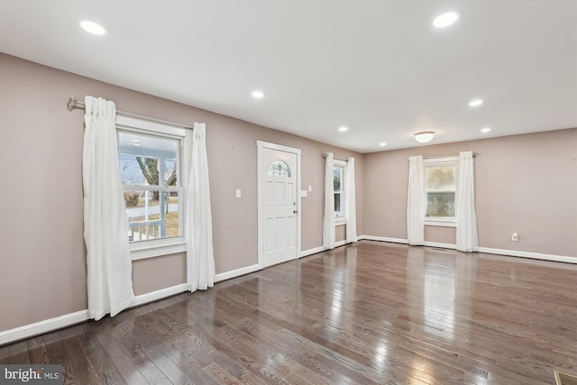 foyer with dark hardwood / wood-style flooring