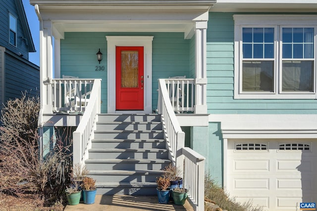 view of exterior entry with a garage