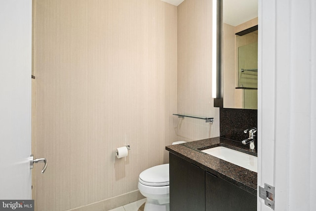 bathroom with vanity and toilet